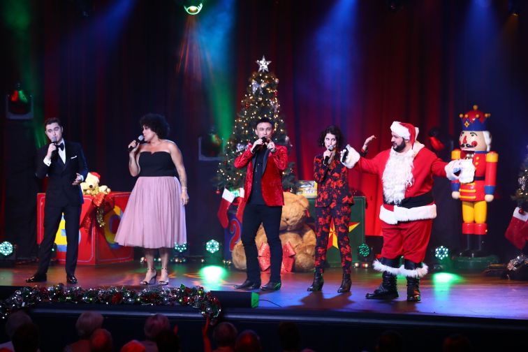 Performers join together on stage at end of Seniors Christmas Concert 2021