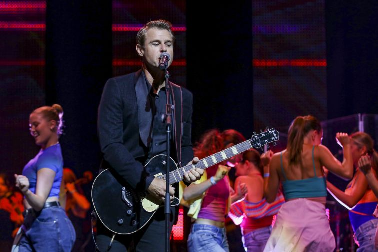 Rodger Corser performing on stage 