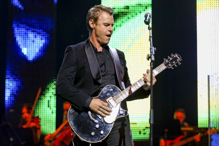 Ross Wilson performing with his guitar