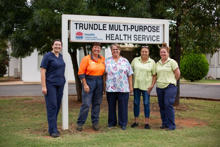 Team Trundle in front of the hospital sign