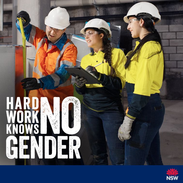 Social media tile for the Women in Construction Gender Diversity Awareness Campaign. The images depicts one man and two women working on a construction site. The man is measuring a mental duct and is supervised by the two women. The slogan Hard Work Knows No Gender is written in white and is located on the left above the blue footer. The footer includes the NSW Government waratah logo justified to the right at the bottom. The tile is 1080x1080 pixels in size.