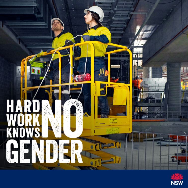 Social media tile for the Women in Construction Gender Diversity Awareness Campaign. The images depicts a man and a woman working on a construction site. The man and woman are on a scissor lift which is surrounded by metal barriers. The slogan Hard Work Knows No Gender is written in white and is located on the left above the blue footer. The footer includes the NSW Government waratah logo justified to the right at the bottom. The tile is 1080x1080 pixels in size.