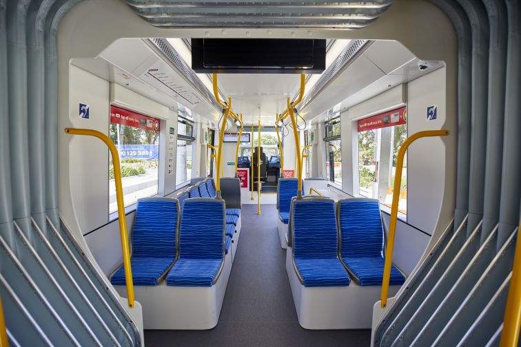 A shot inside one of the Urbos 3 vehicles - showcasing its carriage, including its gleaming new seats and various fixtures.