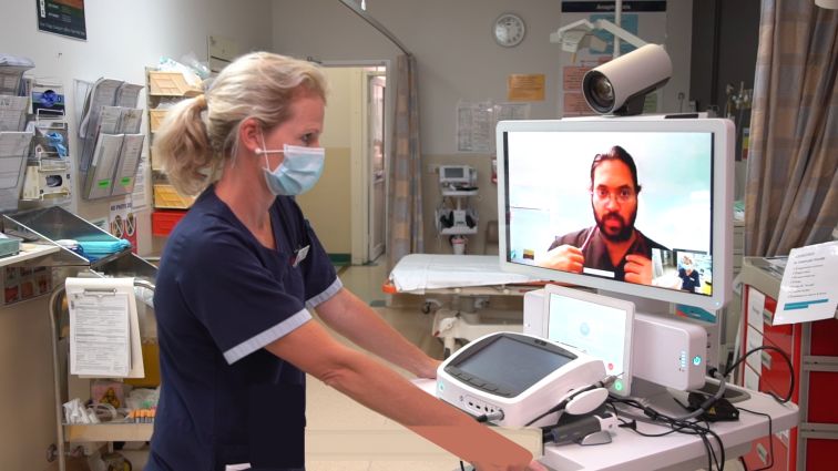 Nurse talking to virtual rural generalist doctor on screen in Western New South Wales