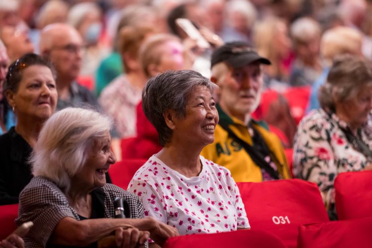 older women laughing in audience