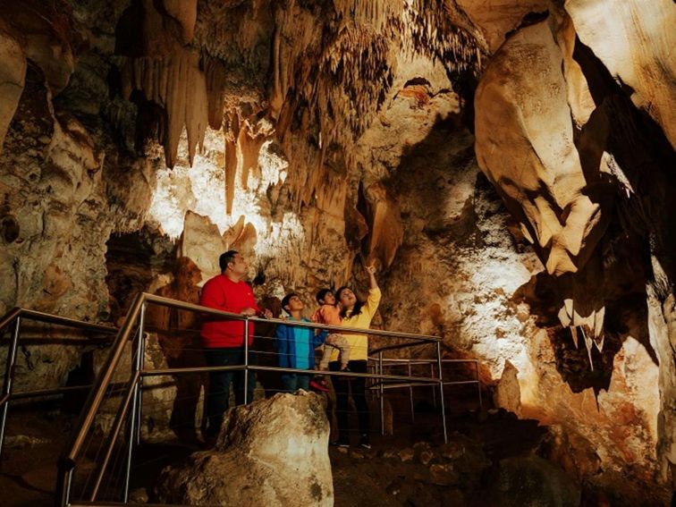Visitors check out impressive cave formations in Wollondilly Cave. Credit: Remy Brand/DPE &copy;