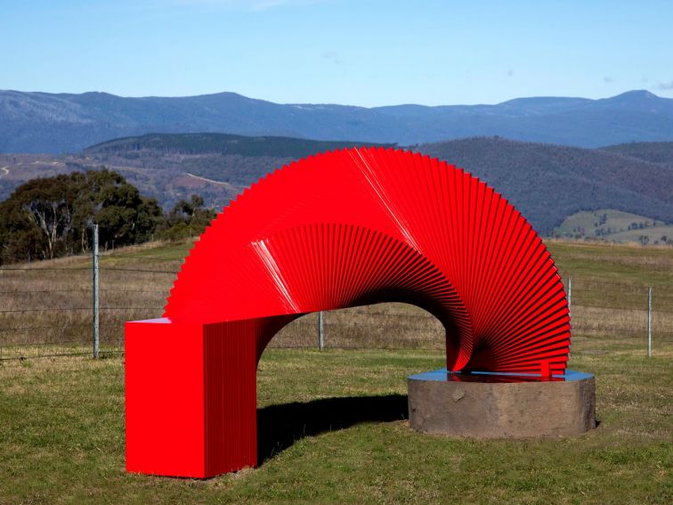 Large bright red sculpture in the scenic Snowy Valleys.