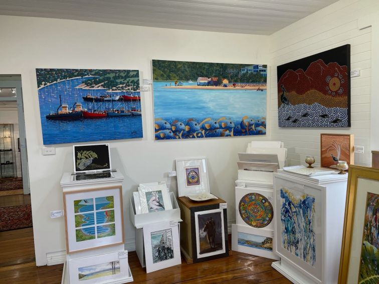 Large and small paintings on display in the gallery