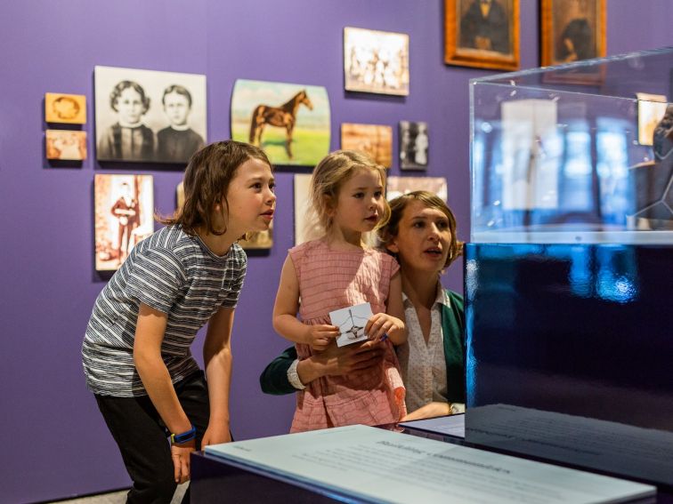 A family explores 'Inherit: old and new histories' at Orange Regional Museum