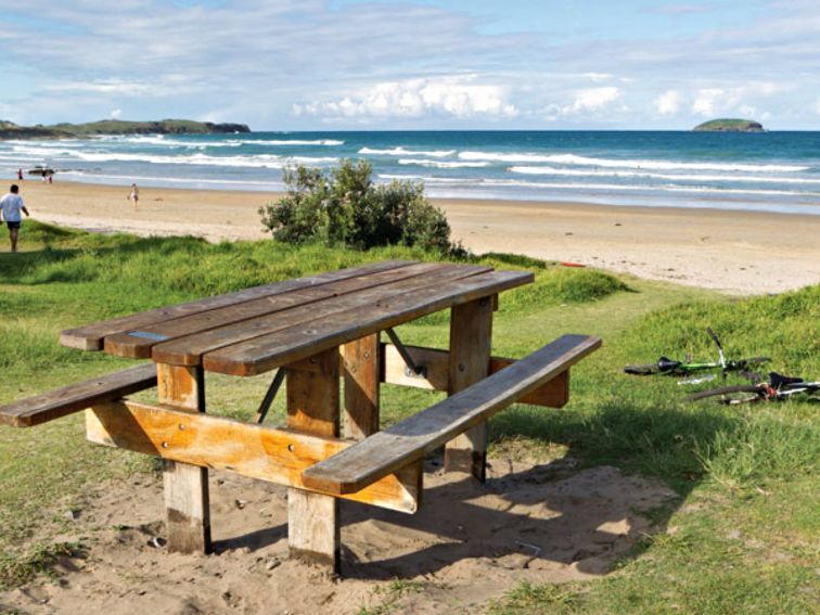 Picnic table beside Emerald Beach, Coffs Coast Regional Park. Photo: Rob Cleary