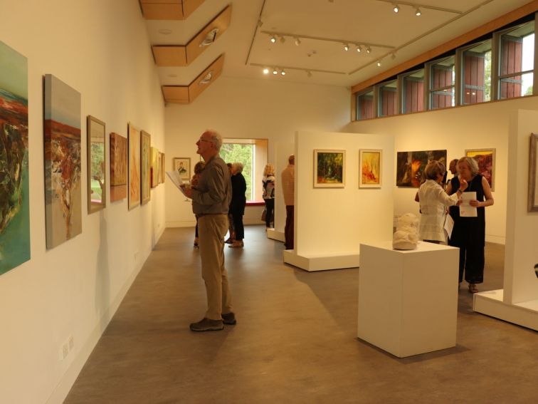 Photo of people looking at an exhibition