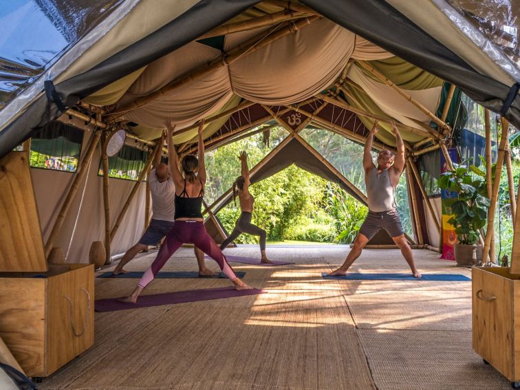 Students practicing yoga at Bamboo Yoga School, Byron Bay