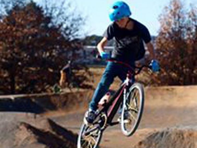 Teenager on BMX riding the track