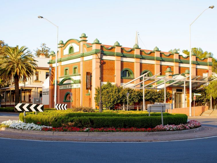 Muswellbrook Regional Arts Centre Building in front of a round about on a sunny day