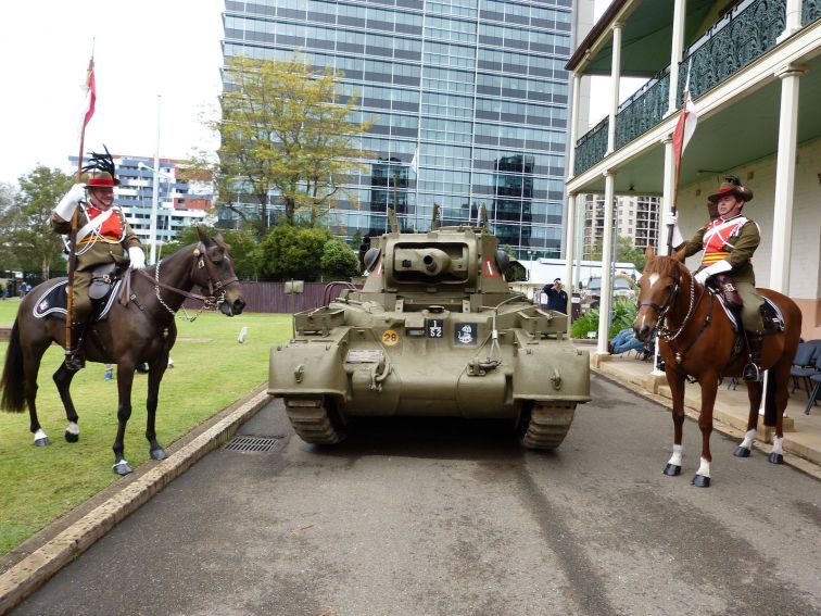 Mounted Lancers in nineteenth century uniform frame the restored WW2 Matilda Tank named ACE