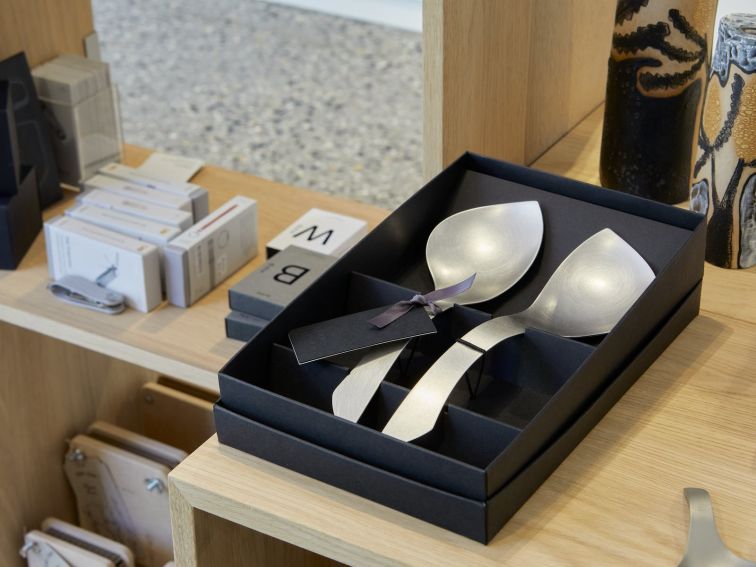 Two serving spoons in a black box
