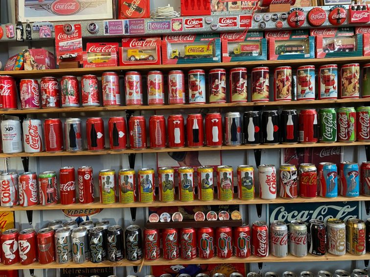 Coke cans and bottels on shelves