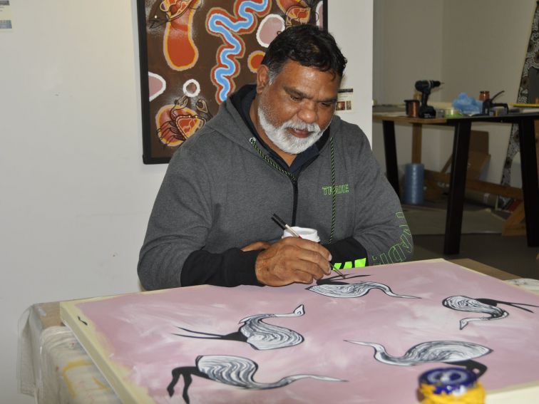 Brian  painting within the Aboriginal Art Gallery