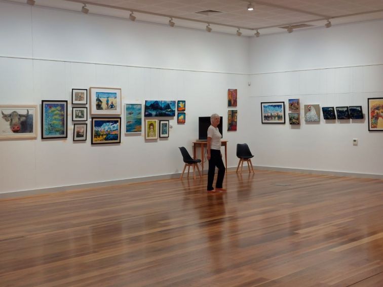 A view of the Art Gallery  with paintings by local artists.