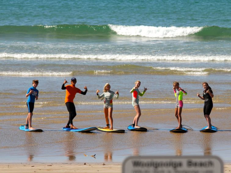 Surfing stoke at Woolgoolga Beach with our experienced coaches