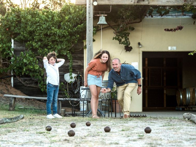 Family enjoying a game of boules at Restdown Wines near Caldwell