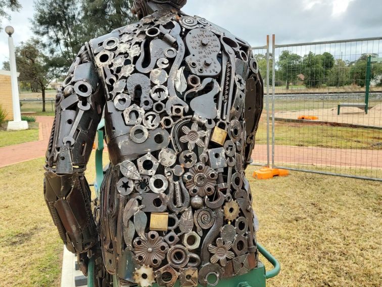 A close up of the back of the Tim Fischer sculpture showing the scrap metal details