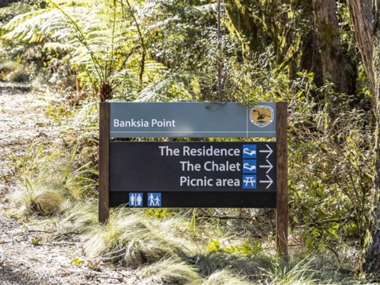 A directional sign at Banksia Point, New England National Park. Photo: Mitchell Franzi &copy; DPIE
