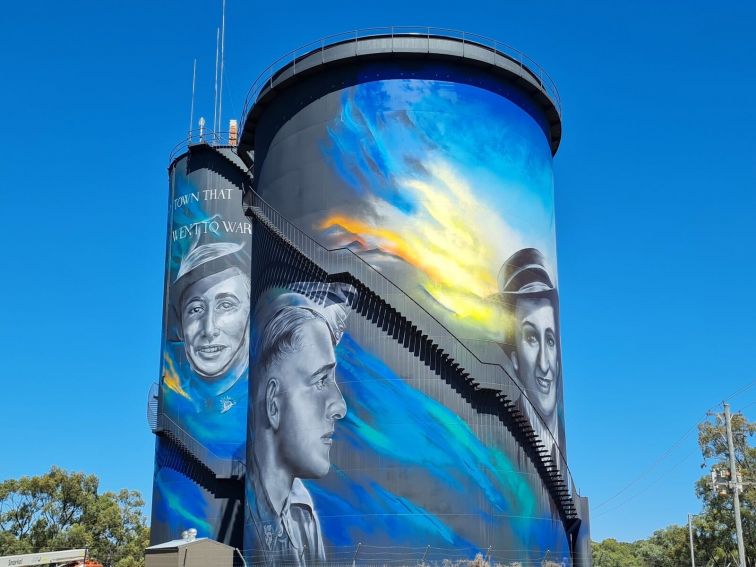 View of two returned serviceman on Hay Water Tower Art