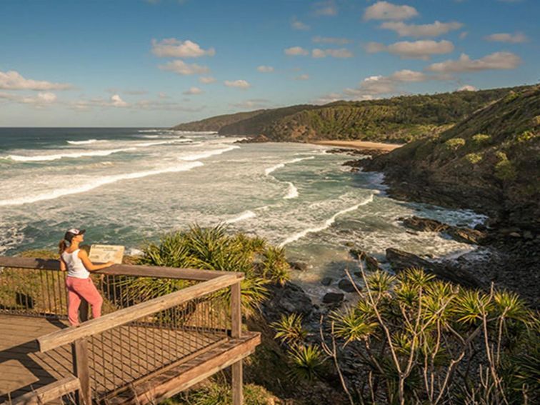 A woman at a lookout along Three Sisters walking track in Broken Head Nature Reserve. Photo: John