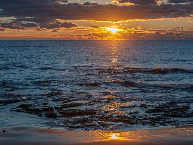 Sunrise over the water at Jervis Bay National Park. Photo: Michael Van Ewijk &copy; DPIE