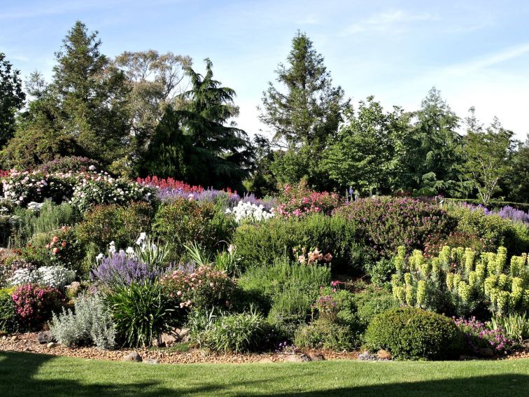 The beautiful garden is edged by sweeping manicured lawns.