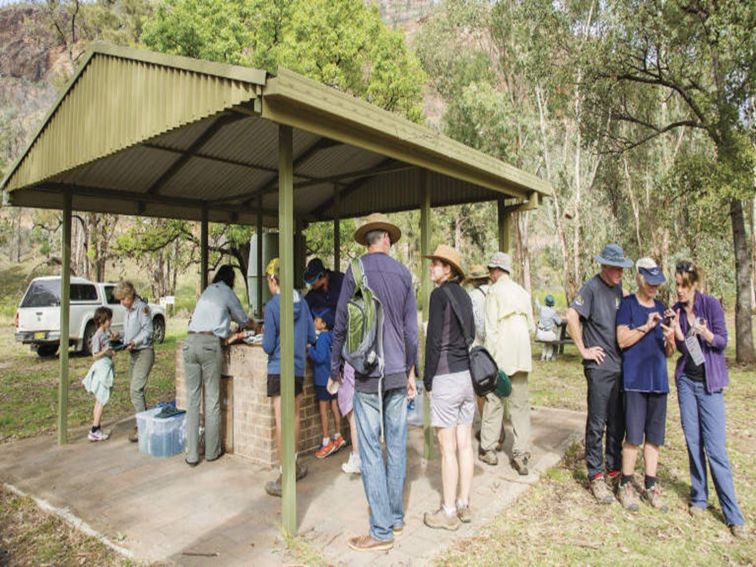A group enjoying a barbecue at Canyon picnic area in Warrumbungle National Park. Photo: Simone