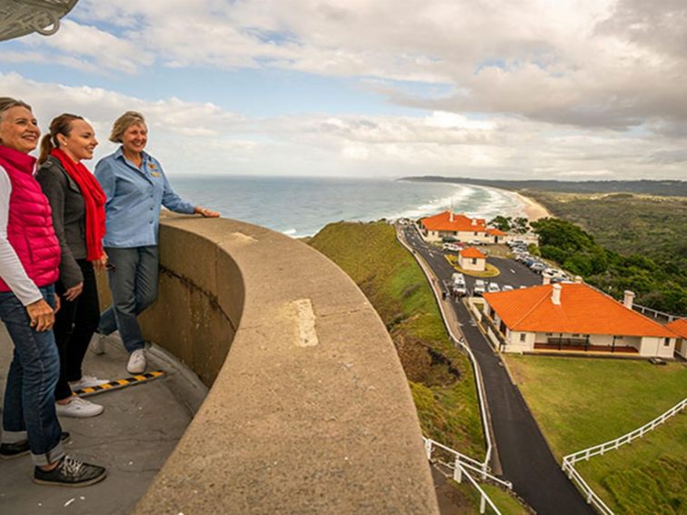 A tour group enjoy views from the top of Cape Byron Lighthouse, Cape Byron State Conservation Area.