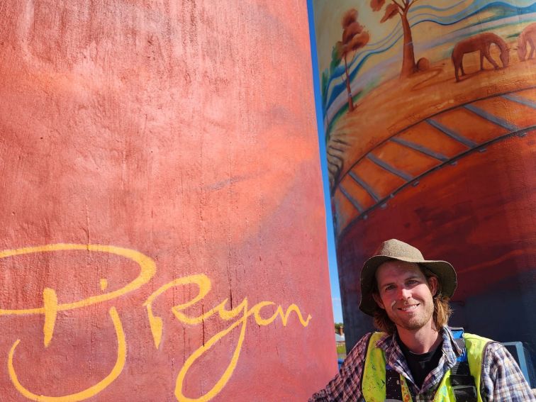 Peter Ryan with his signature on the silo