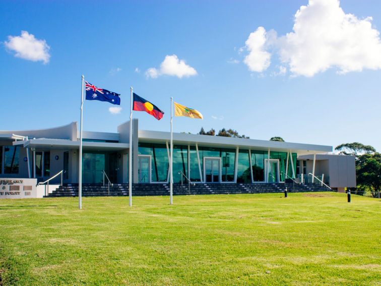 Three flags flying out the front of the Ulladulla Civic Centre