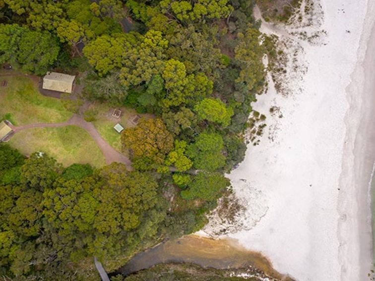 Aerial view of Greenfield Beach picnic area and the nearby beach. Photo: John Spencer/DPIE