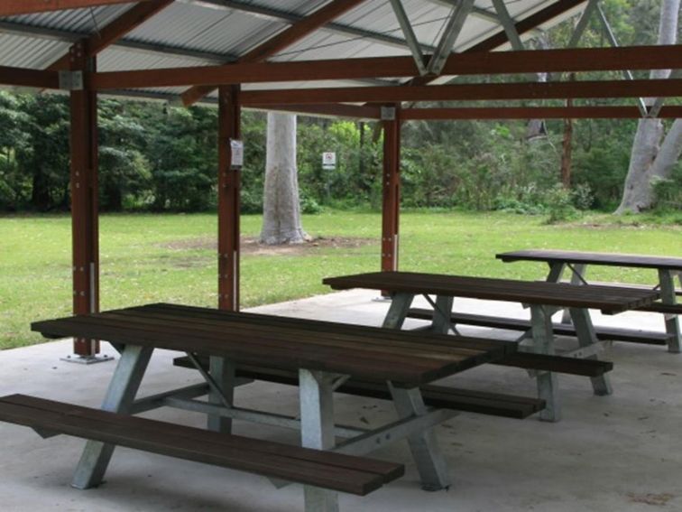 Picnic tables at the picnic shelter in Haynes Flat picnic area, Lane Cove National Park. Photo: