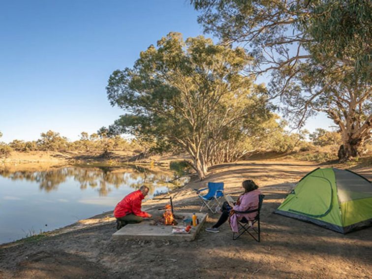 Campers around their campfire at campsite 11, Darling River campground. Photo: John Spencer/DPIE