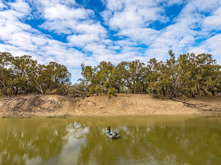 Fishermen in a boat on the Darling River, Toorale National Park. Photo: Joshua Smith/OEH.