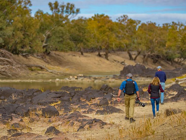 A family walk beside the Darling River, Toorale National Park. Photo: Joshua Smith/OEH.