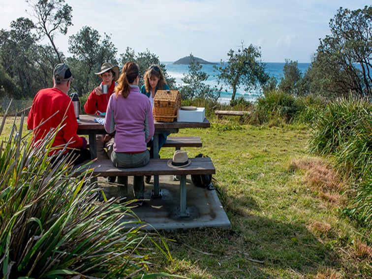 People having lunch at Stokes Island picnic area, Meroo National Park. Photo: Michael van Ewijk/OEH