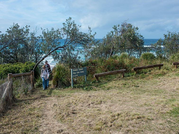 People walking up from the beach at Stokes picnic area, Meroo National Park. Photo: Michael van