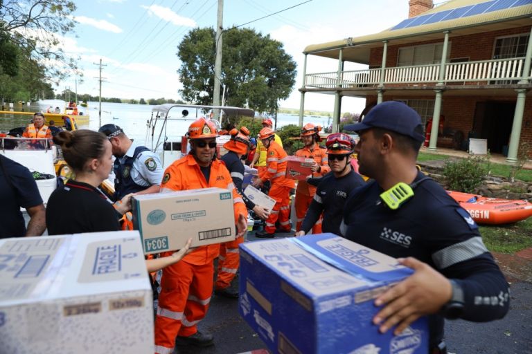 Emergency services pack boats with food supplies after NSW floods.