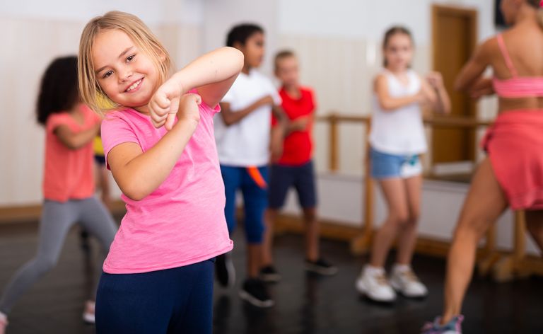 A group of young girls at a dance class