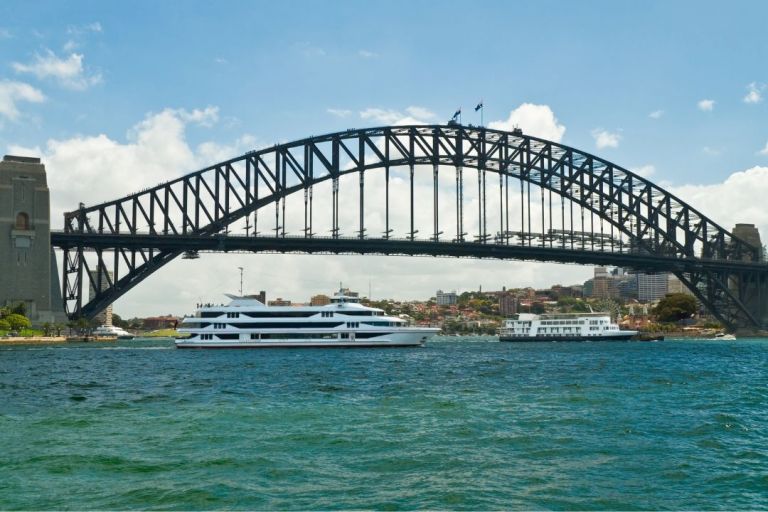 Cruise ships sailing under Sydney Harbour Bridge