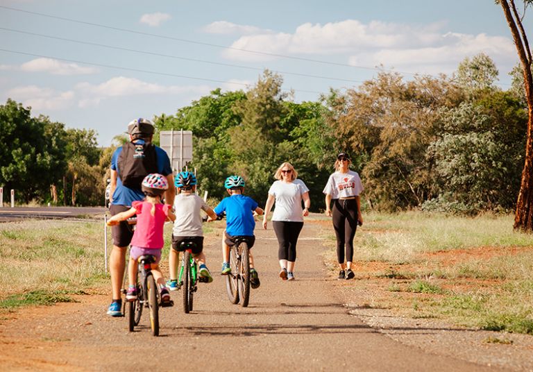 A family riding on a bike trail in Parkes