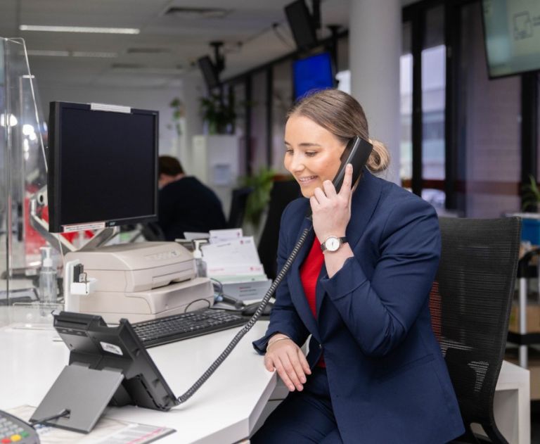 Customer service employee taking phone call