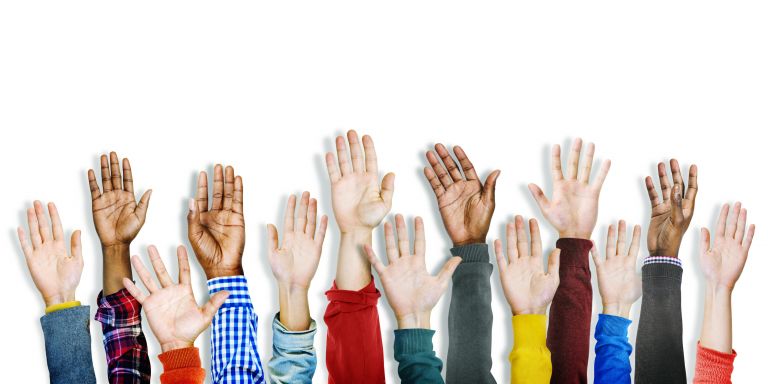 Multiethnic diverse hands raised