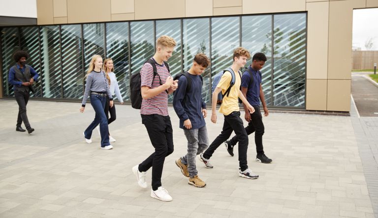 Group of teenagers leaving school