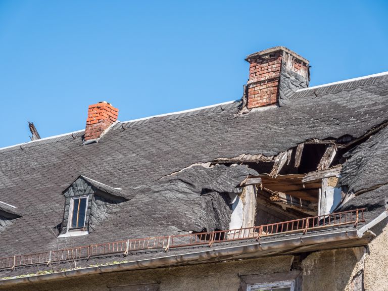 Storm damage to a historic roof
